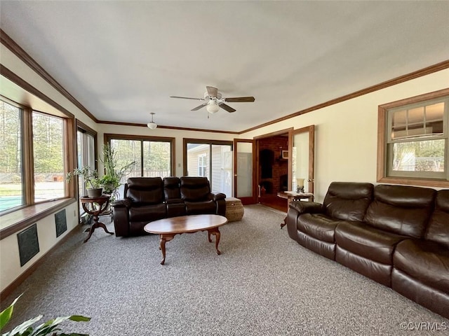 living room featuring crown molding, ceiling fan, and carpet flooring