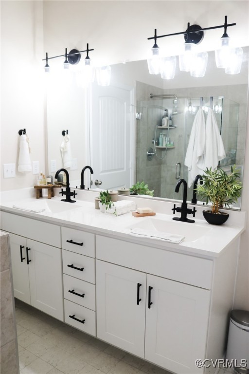 bathroom with vanity and walk in shower