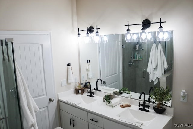 bathroom featuring vanity and a shower with shower door