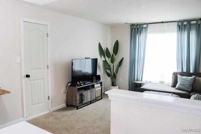 living room featuring light colored carpet