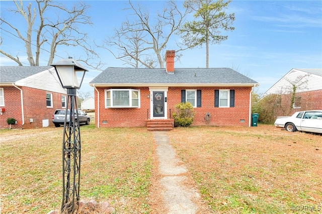 bungalow-style house with a front lawn