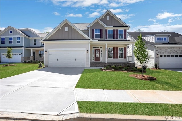 8900 Freebridge Rd, Chesterfield, VA 23832 - view of front of property featuring board and batten siding, driveway, a front yard, and a garage