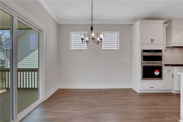 8900 Freebridge Rd, Chesterfield, VA 23832 - unfurnished dining area featuring wood finished floors, a chandelier, and baseboards