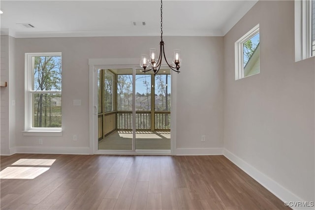 8900 Freebridge Rd, Chesterfield, VA 23832 - unfurnished dining area featuring a chandelier, wood finished floors, and baseboards