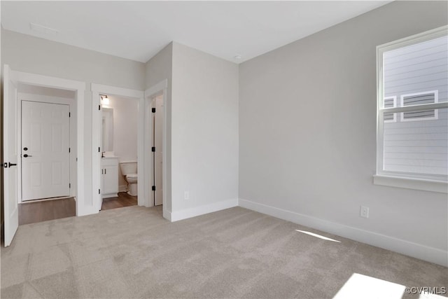 8900 Freebridge Rd, Chesterfield, VA 23832 - unfurnished bedroom with carpet floors, baseboards, and ensuite bathroom