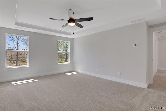 8900 Freebridge Rd, Chesterfield, VA 23832 - spare room with a raised ceiling, light colored carpet, ceiling fan, and baseboards