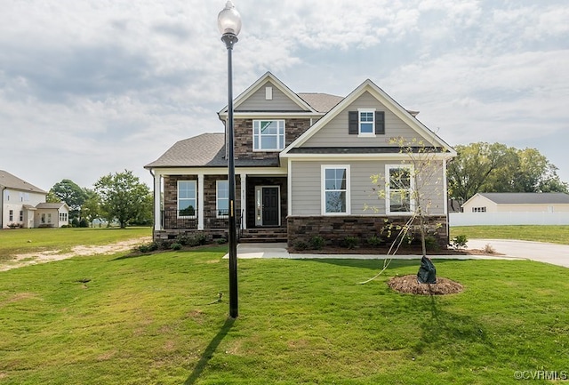 craftsman-style house with a front lawn