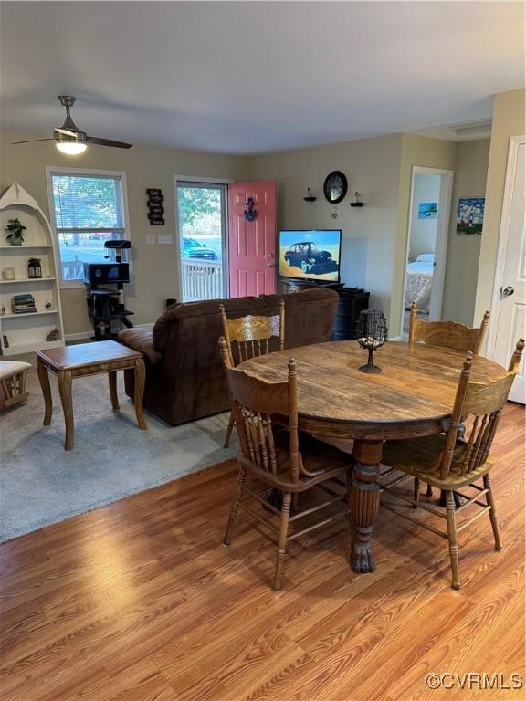 dining space featuring light hardwood / wood-style floors and ceiling fan