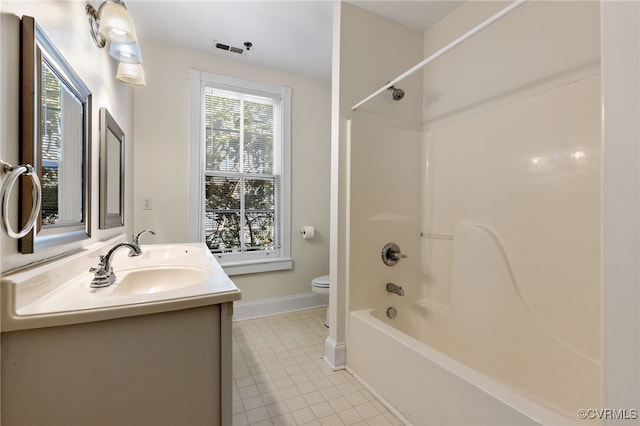 full bathroom featuring tile patterned floors, vanity, toilet, and shower / bath combination