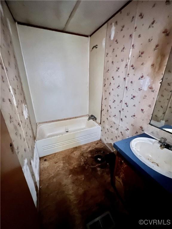 bathroom featuring a bathing tub and vanity