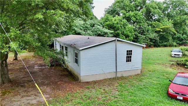 view of property exterior featuring a lawn