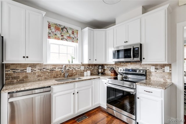 kitchen featuring white cabinetry, stainless steel appliances, and sink