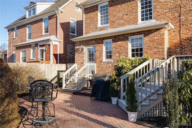 back of property with a patio area