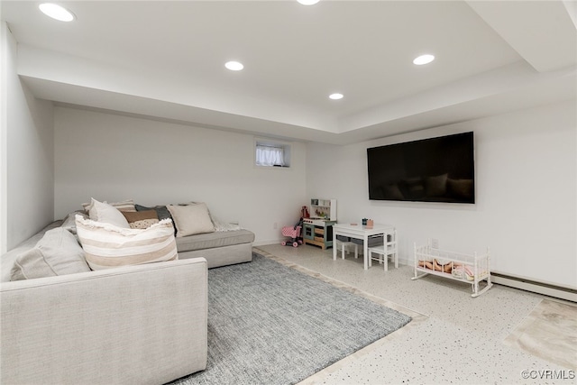 living room with a baseboard heating unit