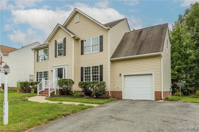 view of front of property featuring a garage and a front yard