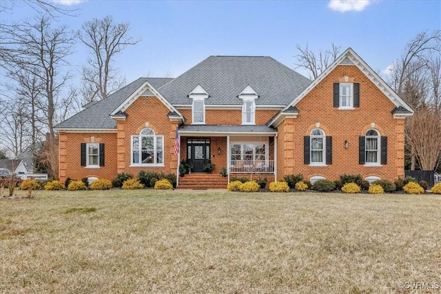 front of property featuring a front yard and a porch