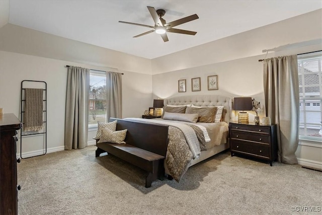 bedroom featuring light colored carpet and ceiling fan