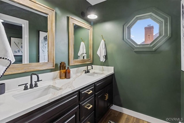 bathroom featuring hardwood / wood-style flooring and vanity