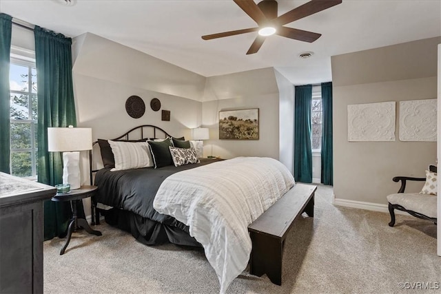 bedroom featuring light carpet and ceiling fan