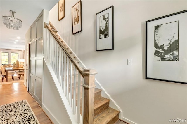 stairs featuring wood-type flooring