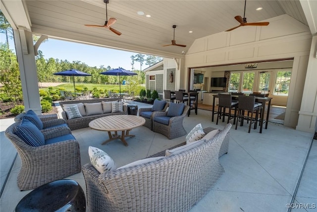 view of patio featuring an outdoor living space and ceiling fan