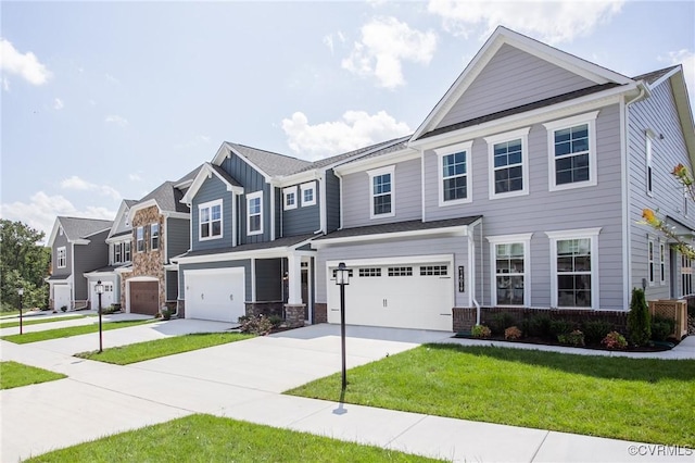 view of front of property with a garage and a front yard