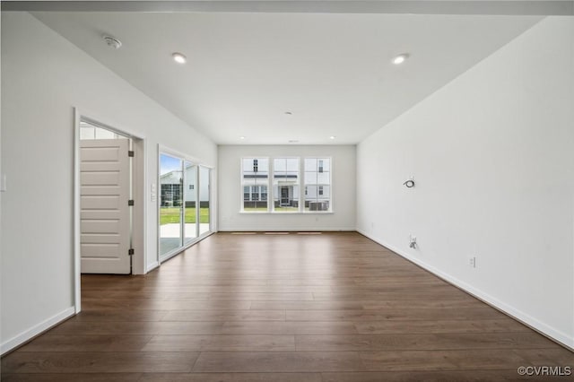 unfurnished living room featuring dark hardwood / wood-style flooring