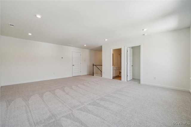 empty room featuring light colored carpet