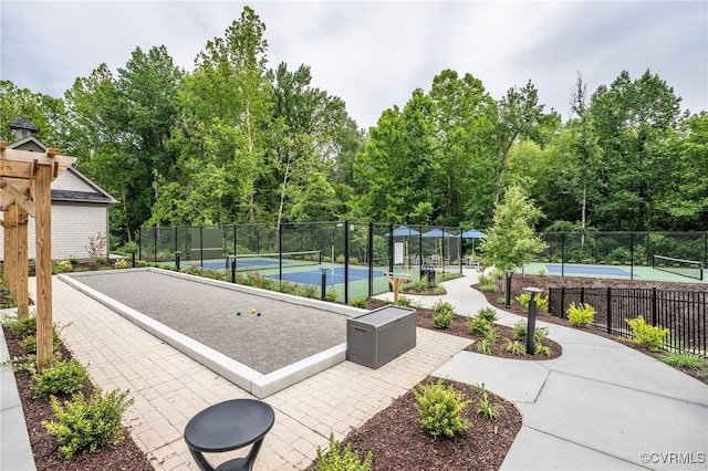 surrounding community featuring tennis court