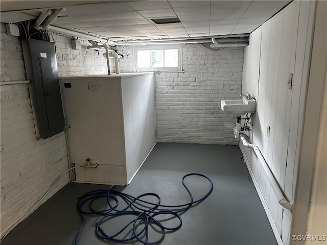 basement with sink and electric panel