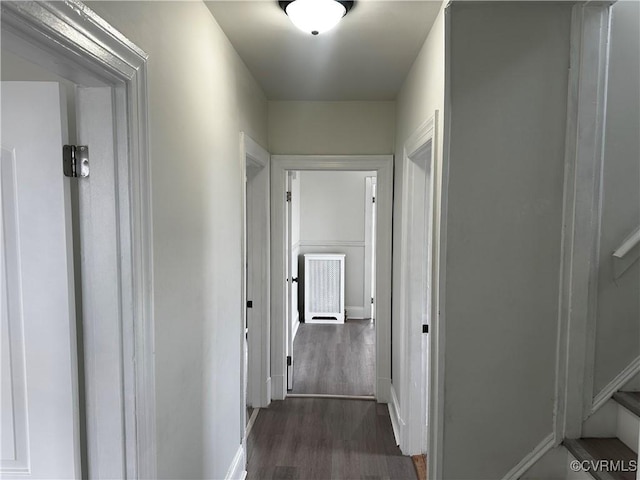 corridor with dark wood-type flooring