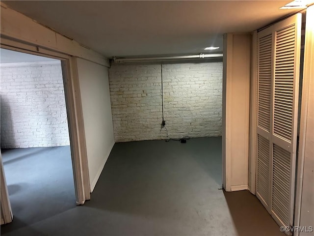 basement with brick wall