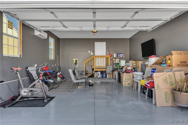 garage featuring a wall mounted air conditioner