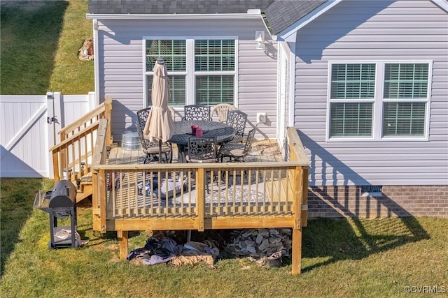 deck featuring a lawn