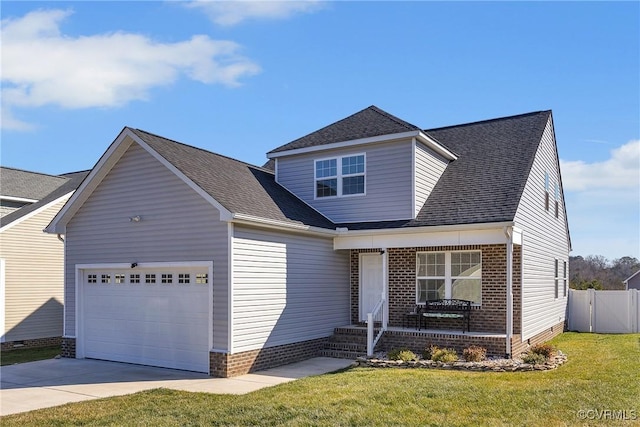 view of front property featuring a garage and a front yard