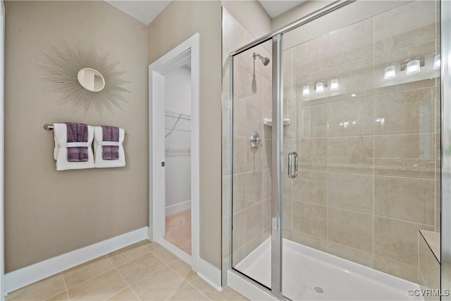 bathroom with tile patterned floors and a shower with shower door