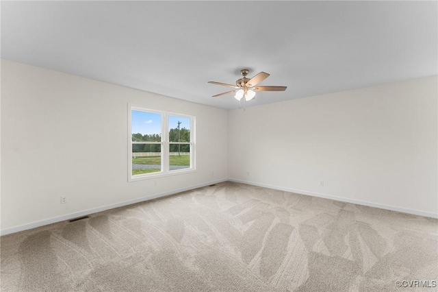 empty room with carpet floors and ceiling fan