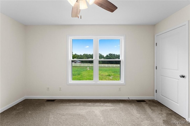 carpeted empty room with ceiling fan