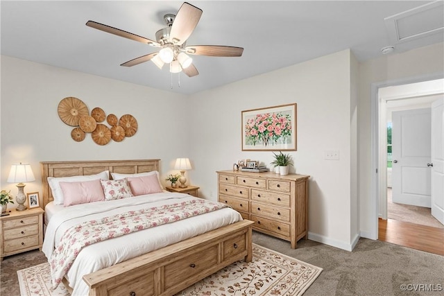 bedroom featuring light colored carpet and ceiling fan