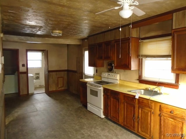 kitchen featuring wood walls, sink, electric range, ceiling fan, and wooden ceiling