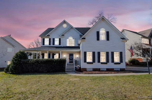 front facade featuring a yard