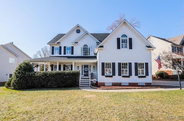 view of front of home featuring covered porch and a front yard