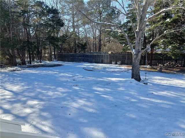 view of yard layered in snow