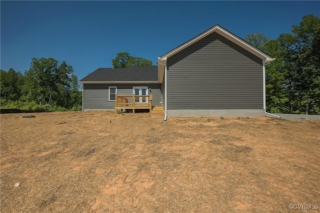 rear view of house with a deck