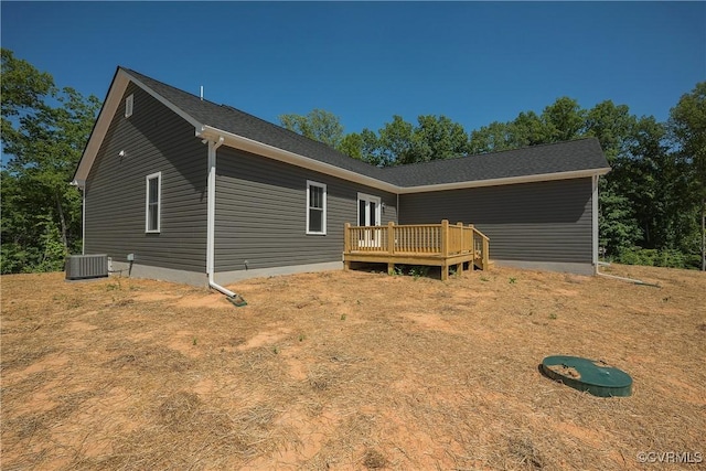 view of front of home featuring a deck and central air condition unit