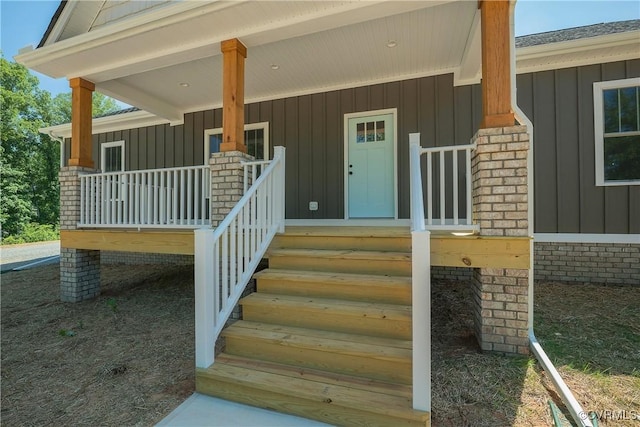 property entrance with covered porch