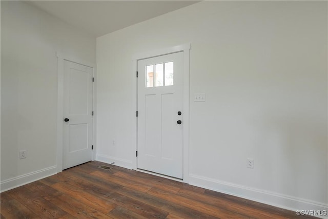 foyer entrance with dark hardwood / wood-style floors