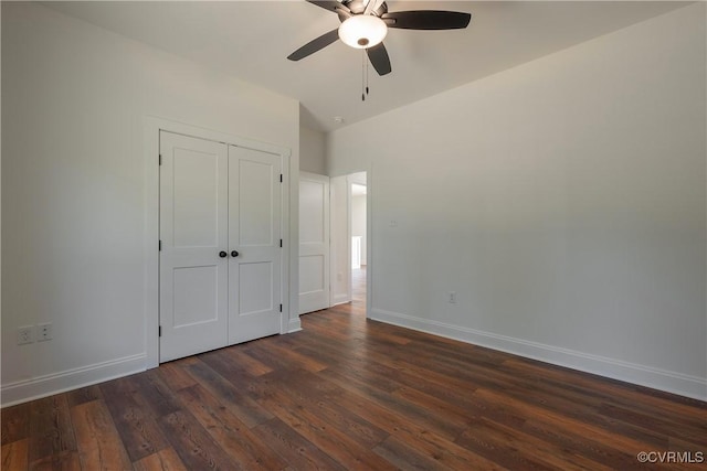 unfurnished bedroom featuring ceiling fan, dark hardwood / wood-style flooring, and a closet