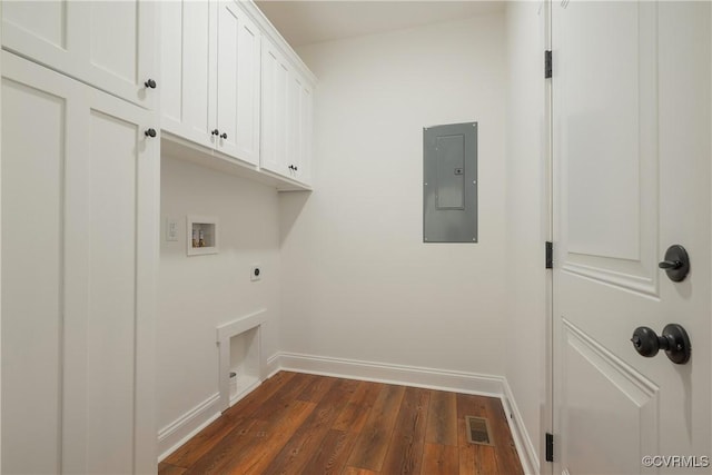 washroom featuring cabinets, washer hookup, electric panel, electric dryer hookup, and dark wood-type flooring