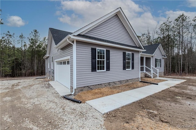 view of side of property with a garage